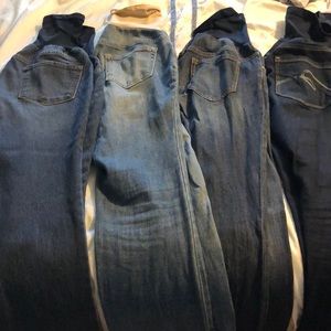 4 pairs of maternity jeans.